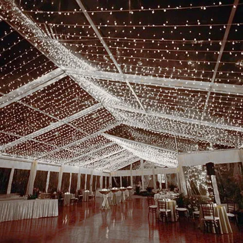 Vista 5 de Novelty Lights Guirnalda de luces de Navidad de 50 pies, 100 bombillas LED blancas puras en cable blanco, espacio de 6 pulgadas, iluminación